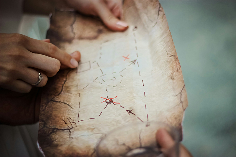 woman's hands holding map